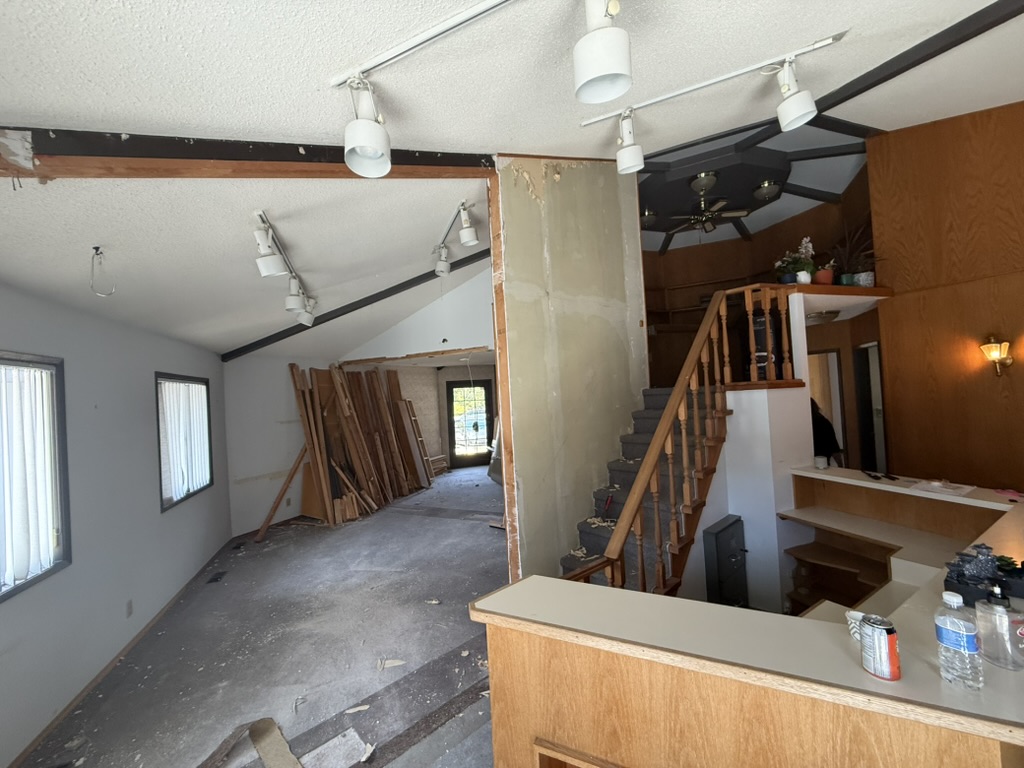 A wide view of the salon during early demolition