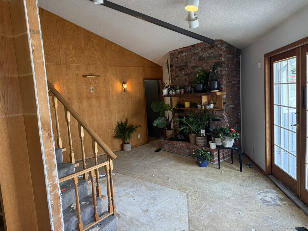 Ground-level view of the future shared waiting area and fireplace